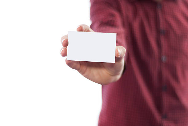 istock Man holding business card isolated on white 491060282