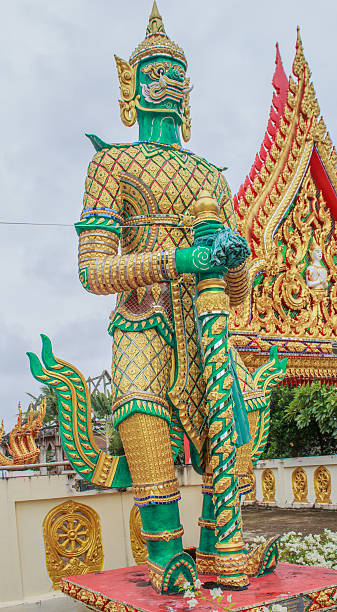 istock giant in front of buddha temple 491062156