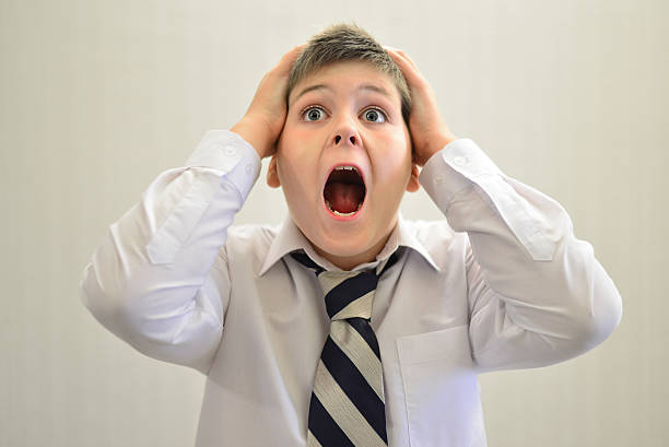 istock Teen boy screaming holding his hands behind  head 491062972