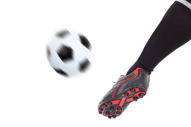 istock foot kicking soccer ball 491064303