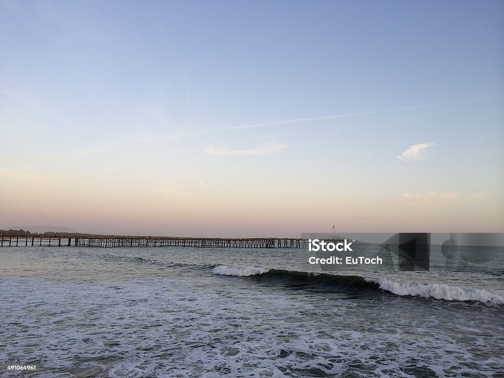 Long Wooden Pier, Ventura, CA Historic wooden pier stretching into the Pacific ocean, evening in Ventura, Southern California Blue Stock Photo