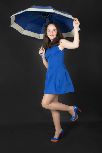 portrait of a teenage girl with an umbrella