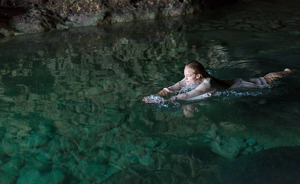 istock Young Woman In A Natural Pool 491066929