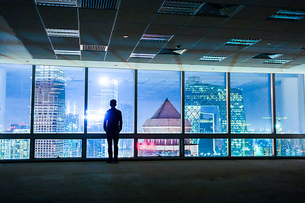 istock Businessman looking out of window 491068520