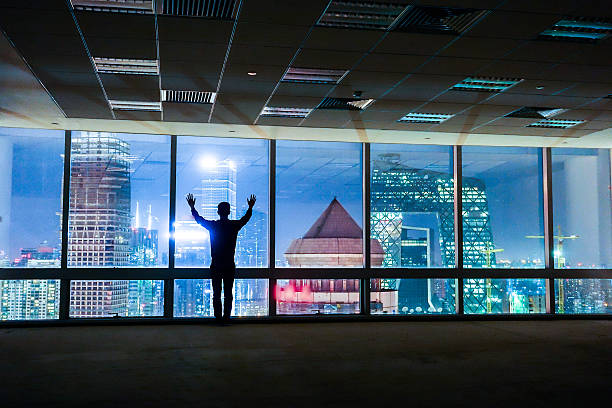 istock Businessman looking out of window 491068598