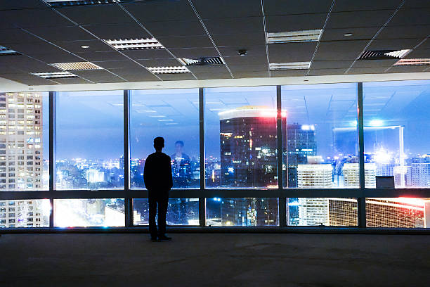 istock Businessman looking out of window 491068728