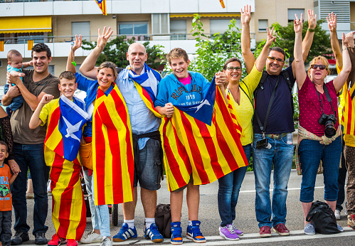 Mataró, Spain- September 11, 2013: People celebrating Catalonia Day. A human chain was formed throughout Catalonia in order to press Spain government to let them vote on the independence of Catalonia. The day is called Diada de Catalunya or La Diada in Catalan. 