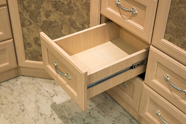 istock Fragment of beige cupboard with drawers 491070116