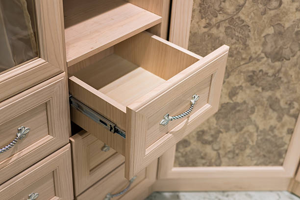 istock Fragment of beige cupboard with drawers 491070122