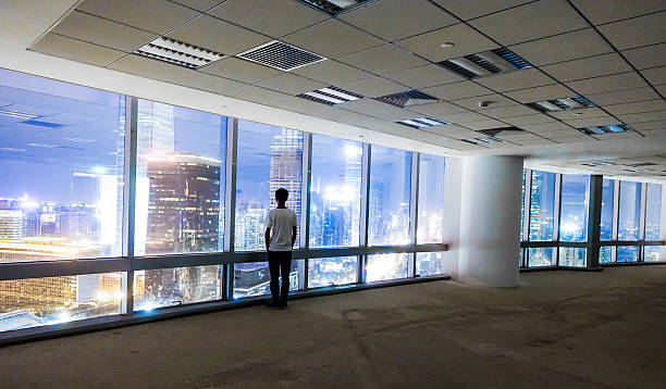 istock Businessman looking at cityscape at night 491070406