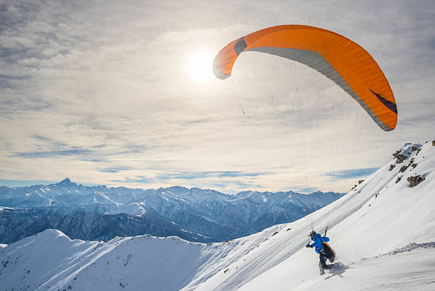 hang glider against a cloudy sky