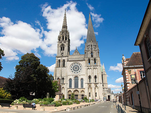 Chartres Cathedral Chartres, France - July 21, 2015: Unidentified people at the Cathedral of Our Lady of Chartres, a medieval Catholic cathedral in Chartres, France, about 80 kilometers southwest of Paris. chartres cathedral stock pictures, royalty-free photos & images