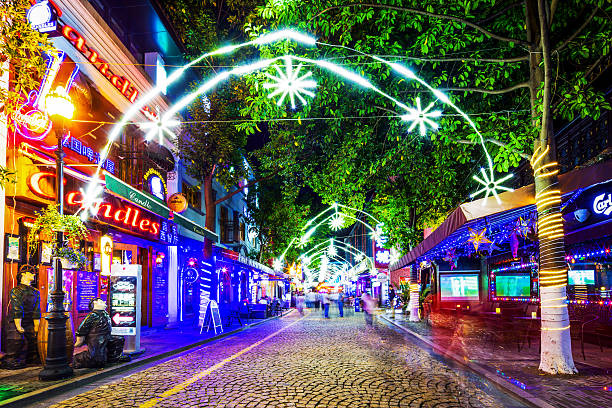 istock road across illuminated shopping street 491083794