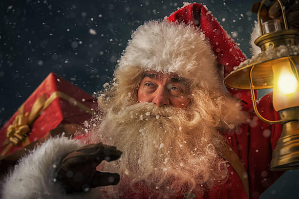 istock Santa Claus holding sack with gifts 491084240