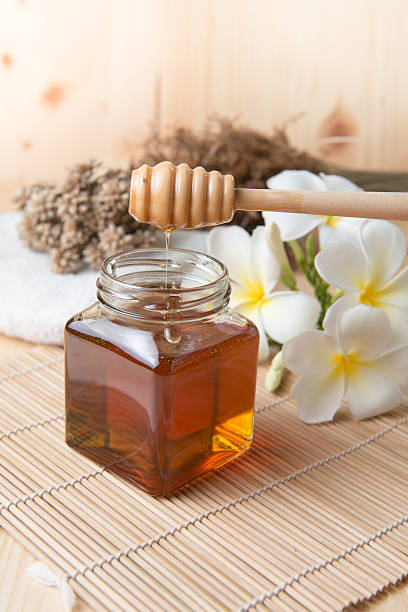 istock honeycomb, honey on wooden background 491085948