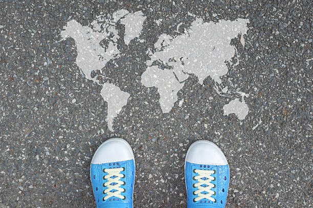 istock Shoes standing in front of the world 491086130