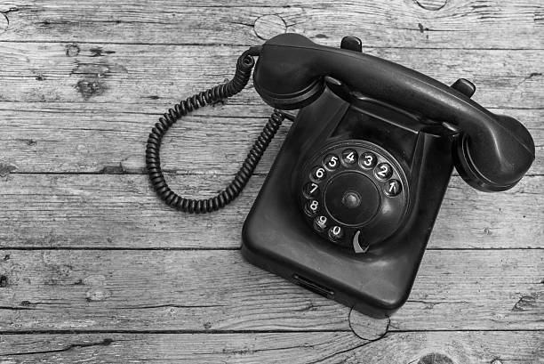 istock Old telephone on wooden background 491086298