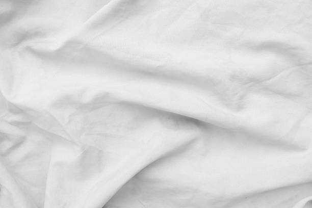 istock Creased white cloth material fragment as a background 491086346