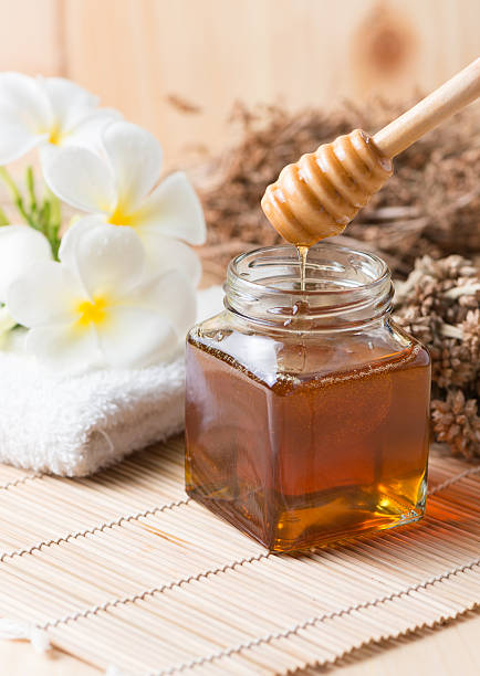 istock honeycomb, honey on wooden background 491086816