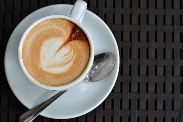 istock White Cup Of Foamy Cappuccino On A Black Background 491089258