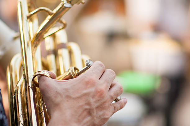 istock detail on a hand plays tuba 491098166