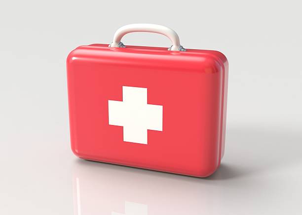 First aid kit First aid kit. Red doctor's bag with white cross on gray background. Emergency, healthcare, paramedic assistance concept.  doctors bag stock pictures, royalty-free photos & images