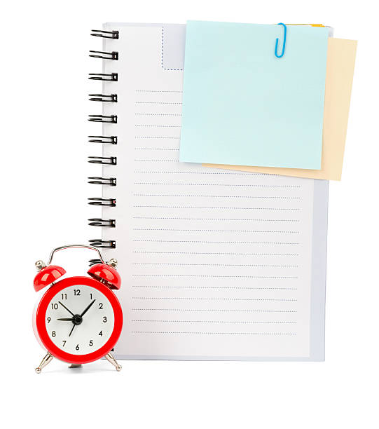 istock Copybook with stickers and alarm clock 491103580