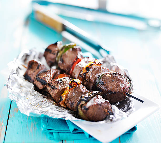 grilled beef steak shish kabobs on tin foil