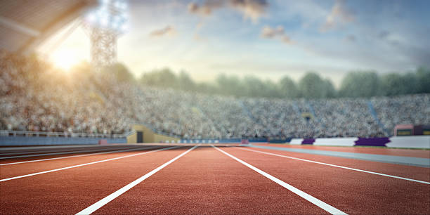 . stadium with running tracks Blurred sunny . sport stadium with crowds of people at the background. On behind the stadium are green trees. The image was made in 3d. track and field stock pictures, royalty-free photos & images