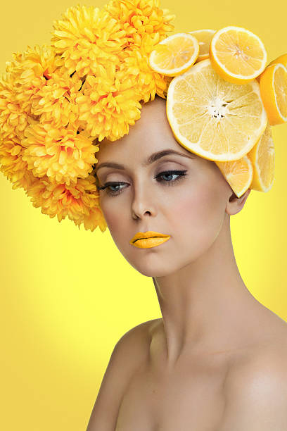 istock Girl with grapefruits and flowers 491115000