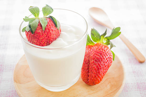 istock Glass of yogurt with fresh strawberry 491116574