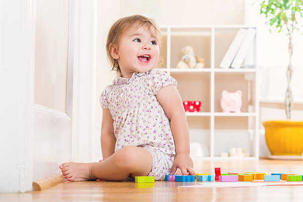 istock Toddler girl with a big smile playing 491132164
