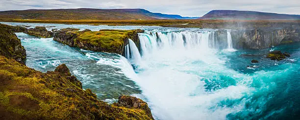 The turquoise waters of the Skjálfandafljót river cascading over the spectacular Godafoss waterfalls in the Arctic north of Iceland. ProPhoto RGB profile for maximum color fidelity and gamut.
