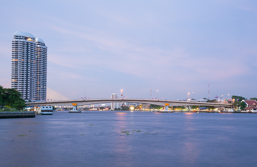 Phra Pinklao Bridge. The bridge over the river in the evening, a car traveling on the bridge.