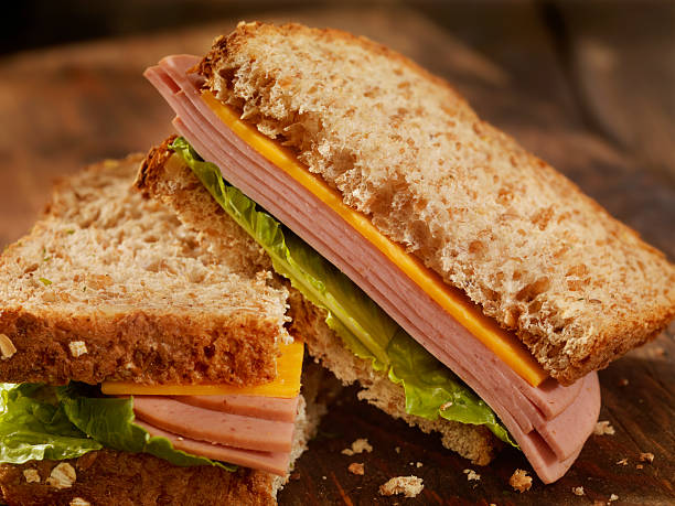 Bologna and Cheese Sandwich Bologna and Cheese Sandwich- Photographed on Hasselblad H3D2-39mb Camera baloney photos stock pictures, royalty-free photos & images