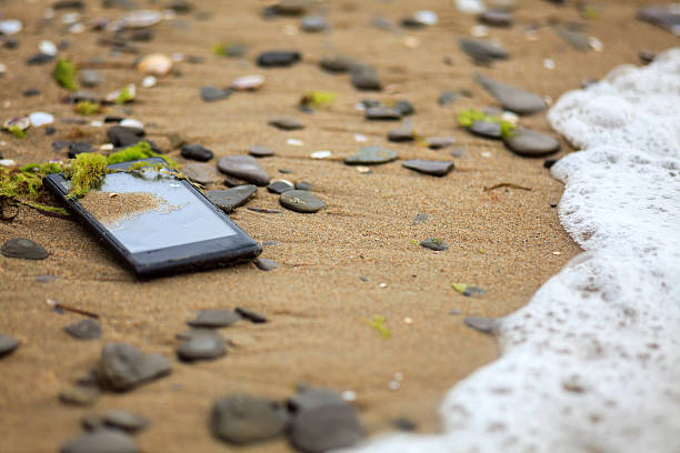 istock Lost Phone In The Sand 491136346
