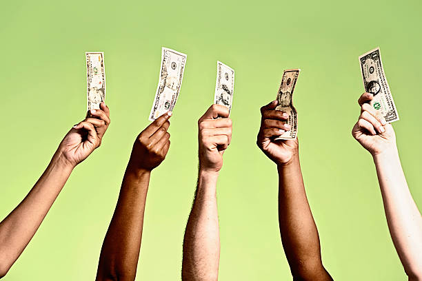 istock Show me the money! Five hands hold up banknotes. 491141427