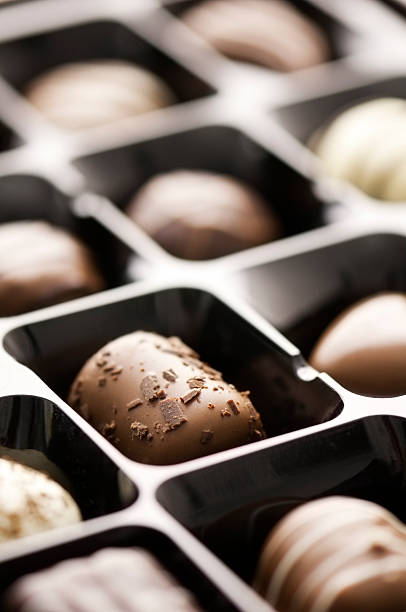 istock Gift box of white dark and milk chocolate candy 491141553