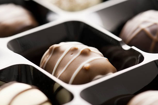 istock Gift box of white dark and milk chocolate candy 491141563