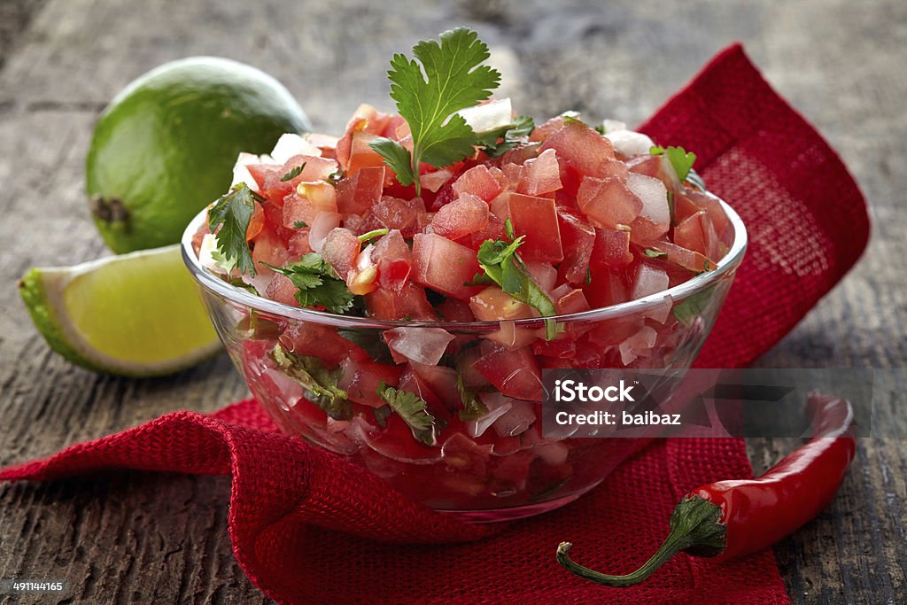Salsa dip Bowl of fresh salsa dip on wooden background Appetizer Stock Photo