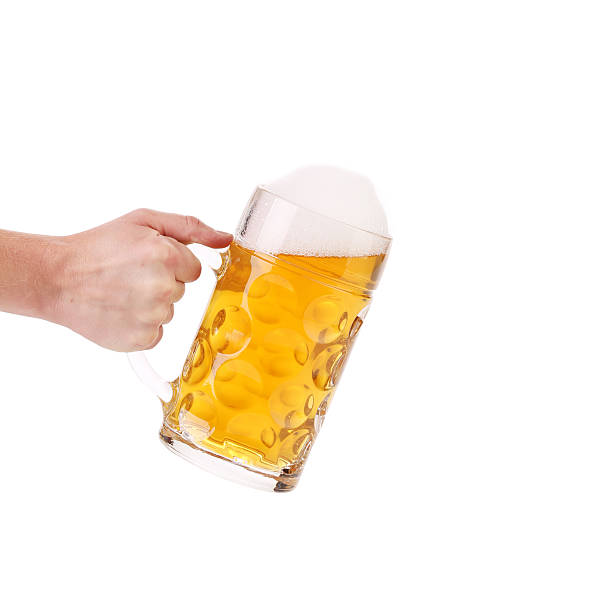 istock Mug of beer with foam in hand. 491146009