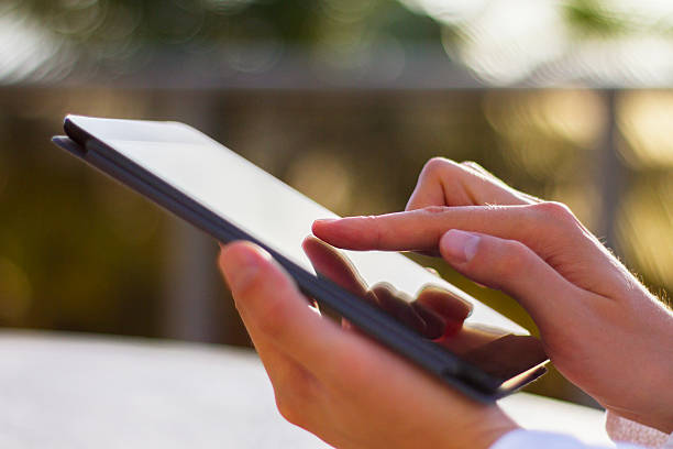 istock man clicks on a digital tablet at morning 491147380