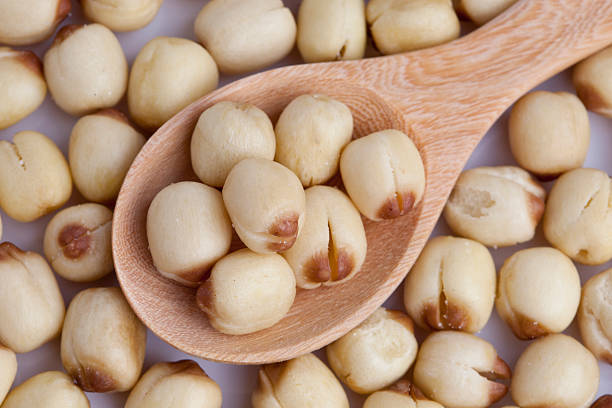 istock close-up lotus seed in wooden spoon 491147780