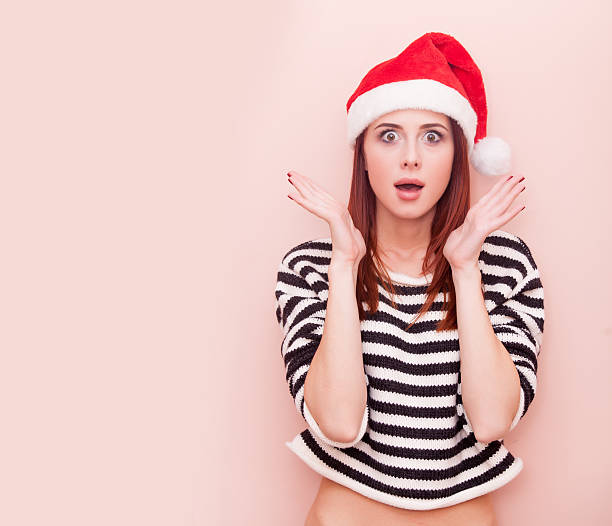 istock girl in Santa Claus hat 491148966
