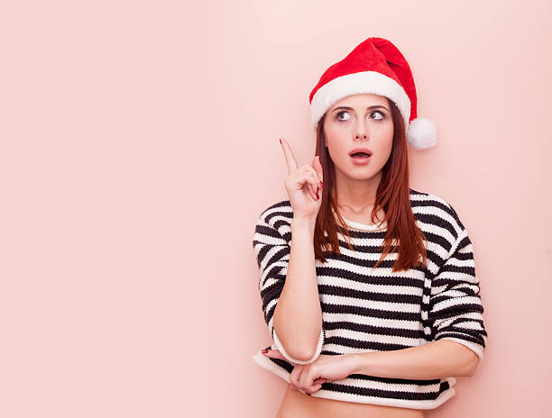istock girl in Santa Claus hat 491148988