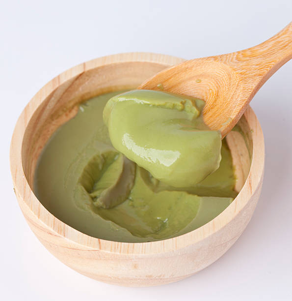 istock Japanese green tea pudding in wooden bowl and spoon 491149506