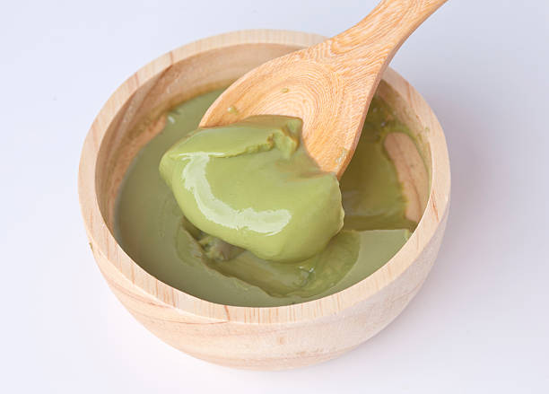 istock Japanese green tea pudding in wooden bowl and spoon 491149708