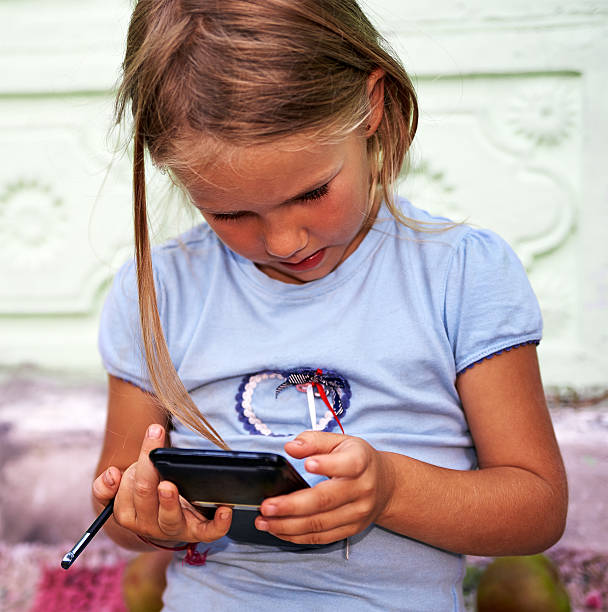 istock Little girl with smartphone 491150766