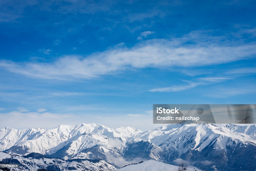 Snow covered mountain tops in the French Alps Winter Stock Photo