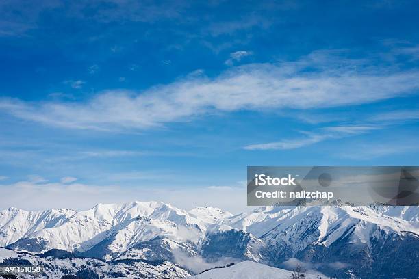 Snow Covered Mountain Tops In The French Alps Stock Photo - Download Image Now - Winter, France, Mountain